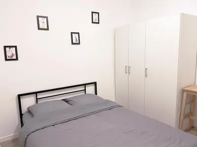 Un ou plusieurs lits dans un hébergement de l'établissement Charmant appartement proche de la Tour Eiffel