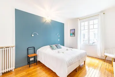 Un ou plusieurs lits dans un hébergement de l'établissement GuestReady - Beautiful Getaway near Eiffel Tower