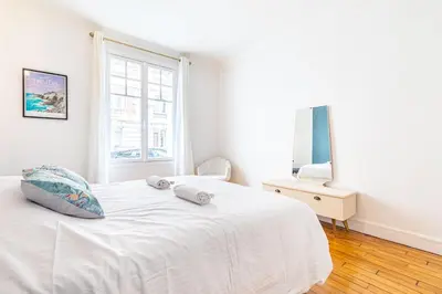 Un ou plusieurs lits dans un hébergement de l'établissement GuestReady - Beautiful Getaway near Eiffel Tower