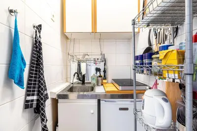 Cuisine ou kitchenette dans l'établissement GuestReady - Stylish Hideaway near Bercy Parc
