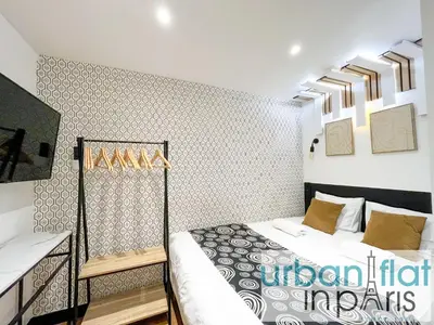 Un ou plusieurs lits dans un hébergement de l'établissement Urban Flat 129 - Art Love Champs-Elysees