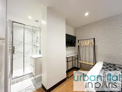 Un ou plusieurs lits dans un hébergement de l'établissement Urban Flat 129 - Art Love Champs-Elysees