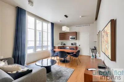 Coin salon dans l'établissement Urban Flat 110 - Luxury 3BDR Flat near Opera Paris