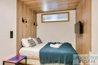 Un ou plusieurs lits dans un hébergement de l'établissement Urban Flat 103 - Spacious Flat near Grands Boulevards