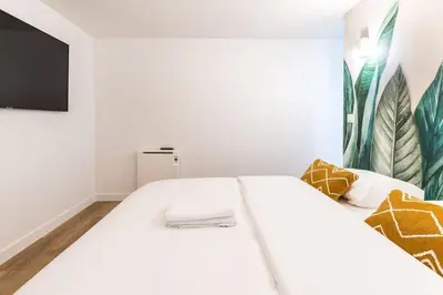 Un ou plusieurs lits dans un hébergement de l'établissement Sentier Réaumur - Beautiful Apartment III
