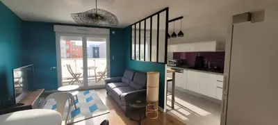 Coin salon dans l'établissement Cozy apartment at Paris doors with free car-park