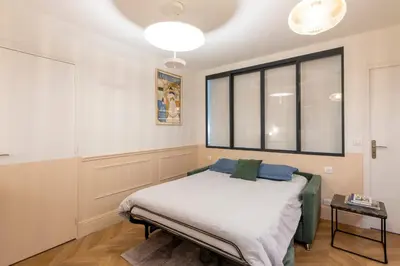 Un ou plusieurs lits dans un hébergement de l'établissement MAISON FRANCOIS : Cosy loft with AC