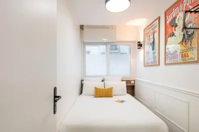 Un ou plusieurs lits dans un hébergement de l'établissement MAISON FRANCOIS : Cosy loft with AC