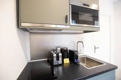 Cuisine ou kitchenette dans l'établissement Studio avec jacuzzi dans le 10e