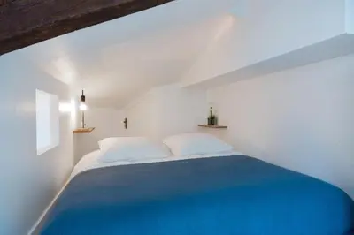 Un ou plusieurs lits dans un hébergement de l'établissement Appartements de charme Paris Expo Porte de Versailles
