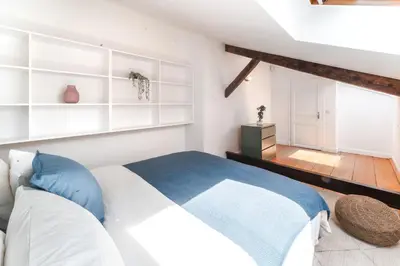 Un ou plusieurs lits dans un hébergement de l'établissement Appartements de charme Paris Expo Porte de Versailles