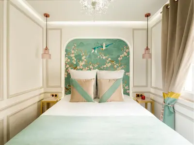 Un ou plusieurs lits dans un hébergement de l'établissement Merveil - Luxury Suite - Champs Elysees -St George