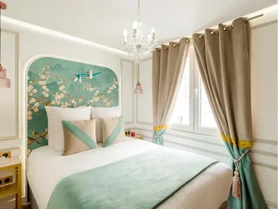 Un ou plusieurs lits dans un hébergement de l'établissement Merveil - Luxury Suite - Champs Elysees -St George