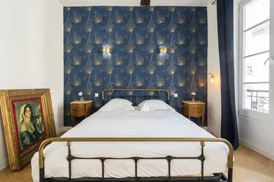 Un ou plusieurs lits dans un hébergement de l'établissement Typical Parisian Flat#3Bedrooms#Opera#Louvre