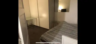 Un ou plusieurs lits dans un hébergement de l'établissement Studio sympa,proche de la gare