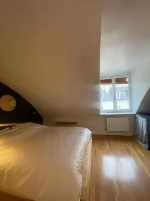 Un ou plusieurs lits dans un hébergement de l'établissement Magnifique appartement Paris 10ème