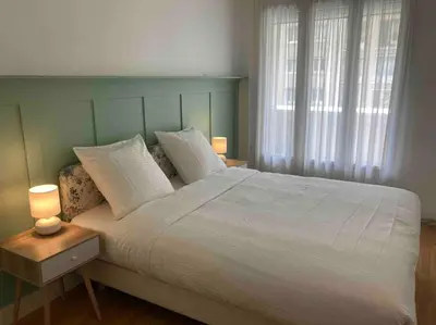 Un ou plusieurs lits dans un hébergement de l'établissement Le Daumesnil Apartment + Balcon 2BR 4/6peoples
