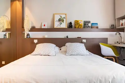 Un ou plusieurs lits dans un hébergement de l'établissement Vivez Paris en famille - 3 chambres by 93 LaF
