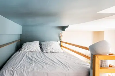 Un ou plusieurs lits dans un hébergement de l'établissement Vivez Paris en famille - 3 chambres by 93 LaF