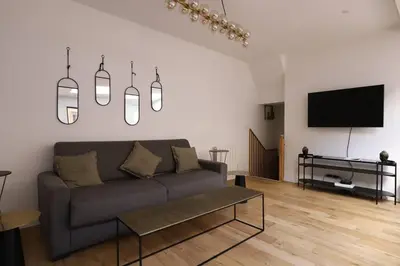 Télévision ou salle de divertissement dans l'établissement Sous Plex 6 personnes - PARIS 11