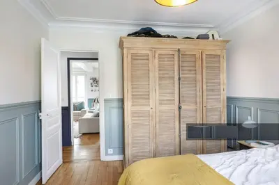 Un ou plusieurs lits dans un hébergement de l'établissement En plein coeur de Levallois appartement de famille