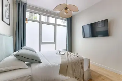 Un ou plusieurs lits dans un hébergement de l'établissement Luxury Apartment 4P - Le Marais - Bastille