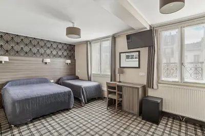 Un ou plusieurs lits dans un hébergement de l'établissement Hotel Telemaque