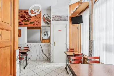 Télévision ou salle de divertissement dans l'établissement Hotel Telemaque