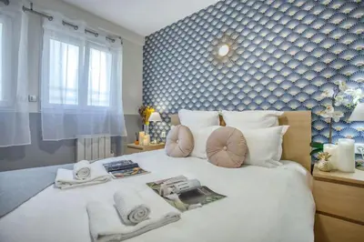 Un ou plusieurs lits dans un hébergement de l'établissement Amazing Apart New Bastille 3 Bedrooms 2 Bathrooms
