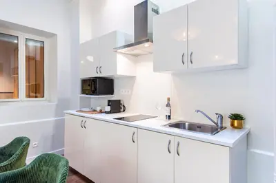 Cuisine ou kitchenette dans l'établissement Sweett - Artois Haussman