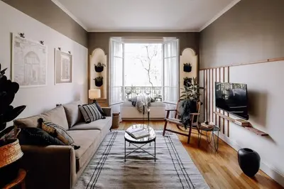 Coin salon dans l'établissement Royo - 1 chambre à Auteuil