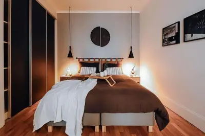Un ou plusieurs lits dans un hébergement de l'établissement Royo - 1 chambre à Auteuil