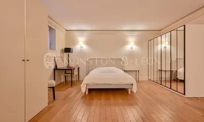 Un ou plusieurs lits dans un hébergement de l'établissement Appartement Paris 7e Invalides Tour Eiffel