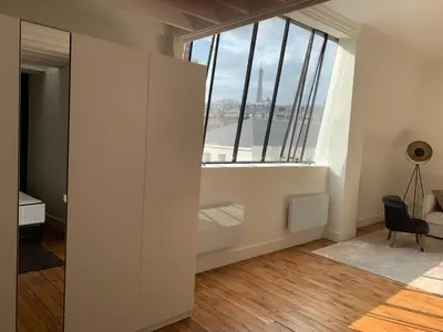 Un ou plusieurs lits dans un hébergement de l'établissement Superbe appartement Tour Eiffel