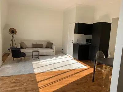 Coin salon dans l'établissement Superbe appartement Tour Eiffel
