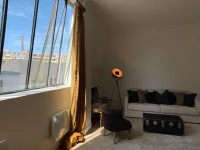 Coin salon dans l'établissement Superbe appartement Tour Eiffel