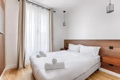 Un ou plusieurs lits dans un hébergement de l'établissement MyKeypers - Amazing Luxe & Cosy Flat 2BR/6P - Bastille