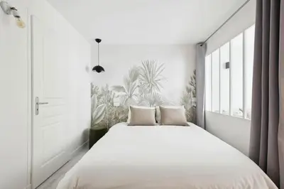 Un ou plusieurs lits dans un hébergement de l'établissement MyKeypers - Cosy & Design Parisian Flat 4P - Batignolles