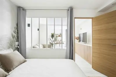 Un ou plusieurs lits dans un hébergement de l'établissement MyKeypers - Cosy & Design Parisian Flat 4P - Batignolles