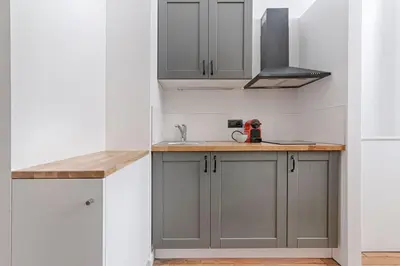 Cuisine ou kitchenette dans l'établissement Cozy Duplex 6P - Arc de Triomphe