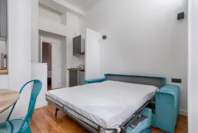 Un ou plusieurs lits dans un hébergement de l'établissement Luxury LOFT 6P - Arc de Triomphe