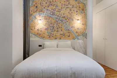 Un ou plusieurs lits dans un hébergement de l'établissement Luxury LOFT 6P - Arc de Triomphe