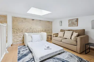 Un ou plusieurs lits dans un hébergement de l'établissement Luxury living: appartement contemporain by Weekome