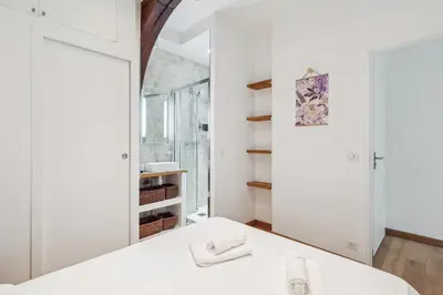 Un ou plusieurs lits dans un hébergement de l'établissement Luxury living: appartement contemporain by Weekome