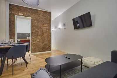 Télévision ou salle de divertissement dans l'établissement Apartment Center of Paris by Studio prestige