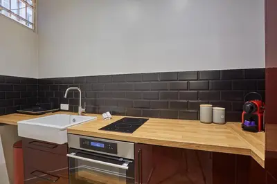 Cuisine ou kitchenette dans l'établissement Apartment Center of Paris by Studio prestige