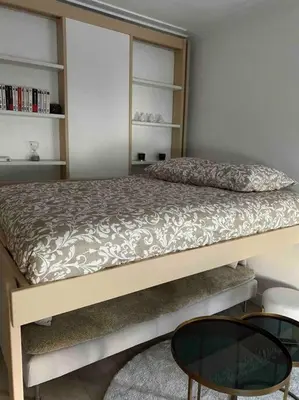 Un ou plusieurs lits dans un hébergement de l'établissement Joli studio paris 17