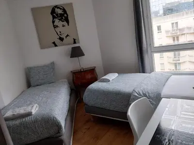 Un ou plusieurs lits dans un hébergement de l'établissement Appartement la défense Courbevoie