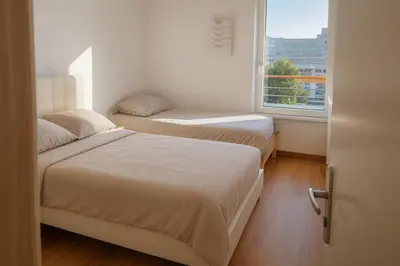 Un ou plusieurs lits dans un hébergement de l'établissement Bel appartement près du métro