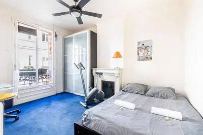Un ou plusieurs lits dans un hébergement de l'établissement GuestReady -Logement accueillant proche Montmartre